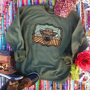 Shipping Dept. "HIGHLAND COW and the MOUNTAINS" on MILITARY SWEATSHIRT - THE ROAMING SAGUARO COLLECTION by Meghan Wolff
