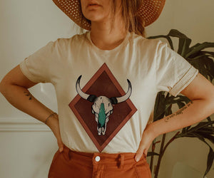 Shipping Dept. Turquoise Cow Skull CREAM T-Shirt - THE ROAMING SAGUARO COLLECTION by Meghan Wolff